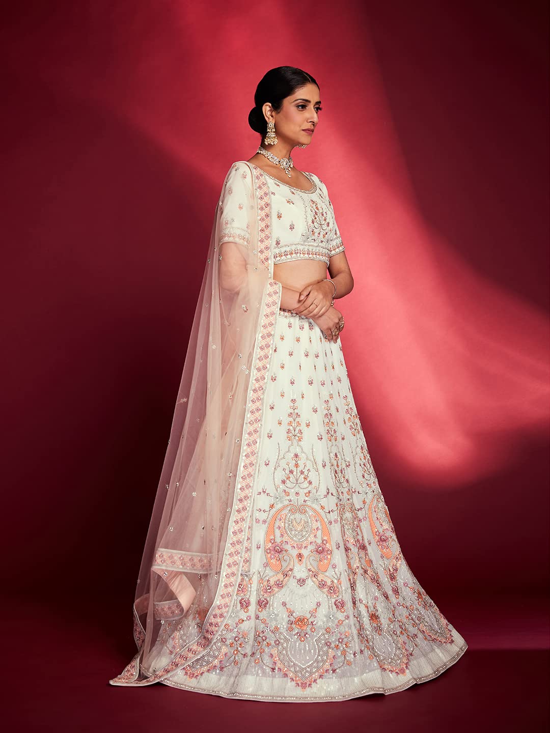 FUSIONIC This outfit is beautifully decorated intricately with sequin and zarkan. The White georgette lehenga will come with matching dupatta and blouse.
