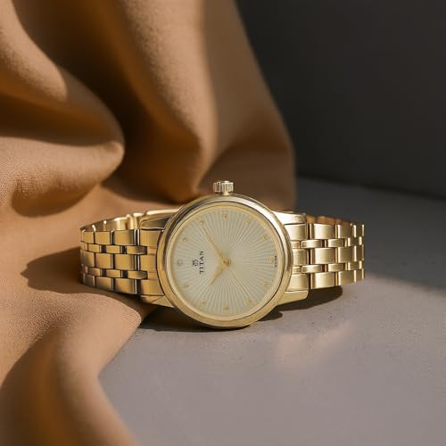 Titan Karishma Quartz Analog Champagne Round Dial Golden Stainless Steel Strap Watch for Women - NT2593YM01