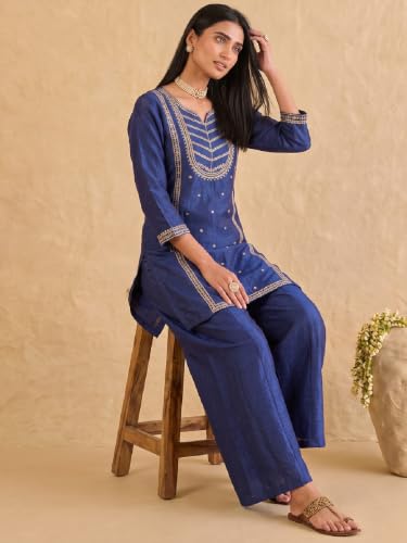 Varanga embroidered kurta set paired with a shimmering organza dupatta.
