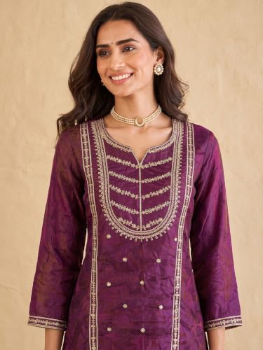 wine embroidered kurta set paired with a shimmering organza dupatta.