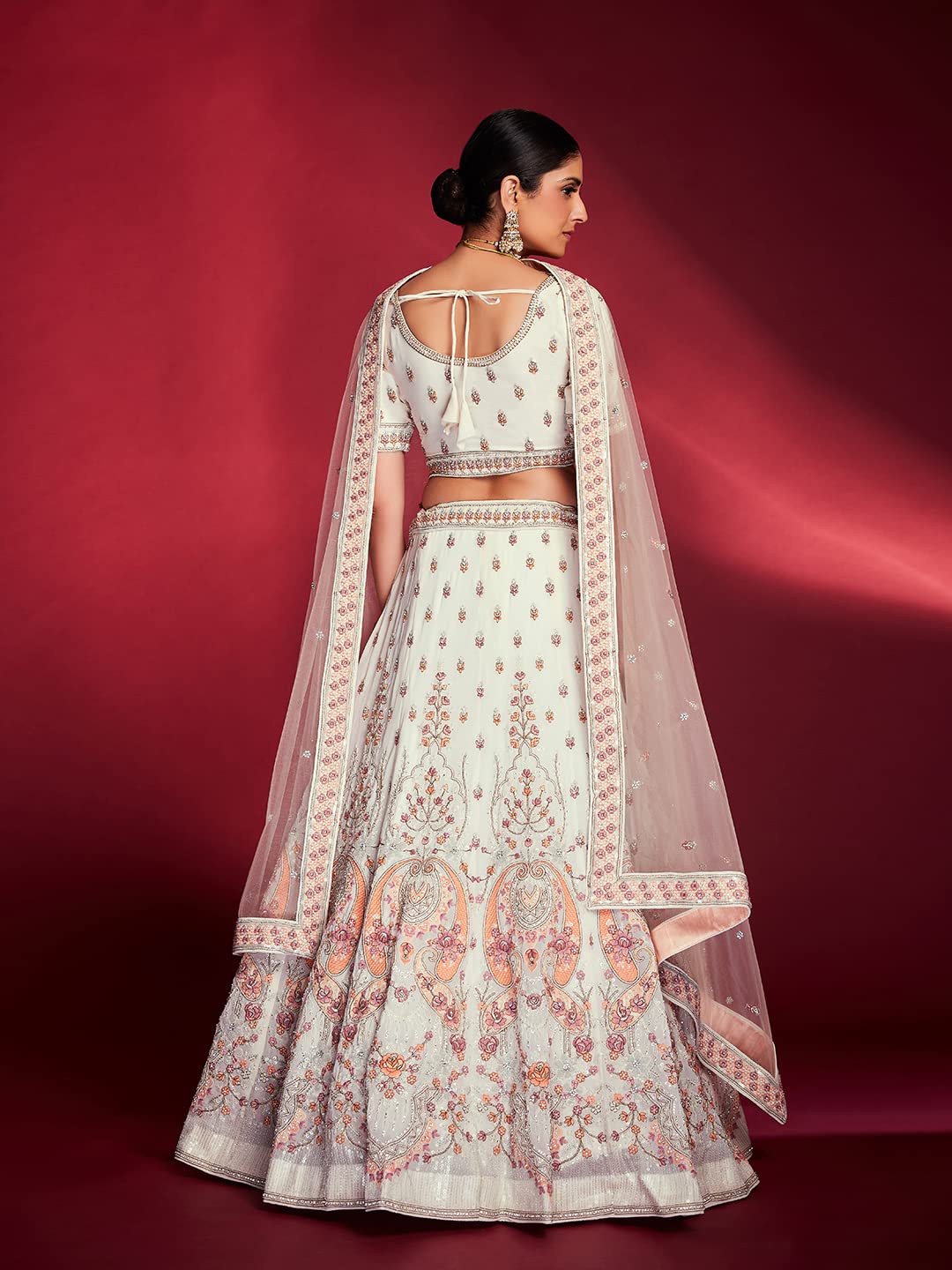 FUSIONIC This outfit is beautifully decorated intricately with sequin and zarkan. The White georgette lehenga will come with matching dupatta and blouse.