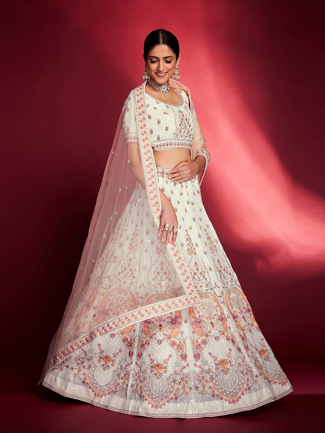 FUSIONIC This outfit is beautifully decorated intricately with sequin and zarkan. The White georgette lehenga will come with matching dupatta and blouse.