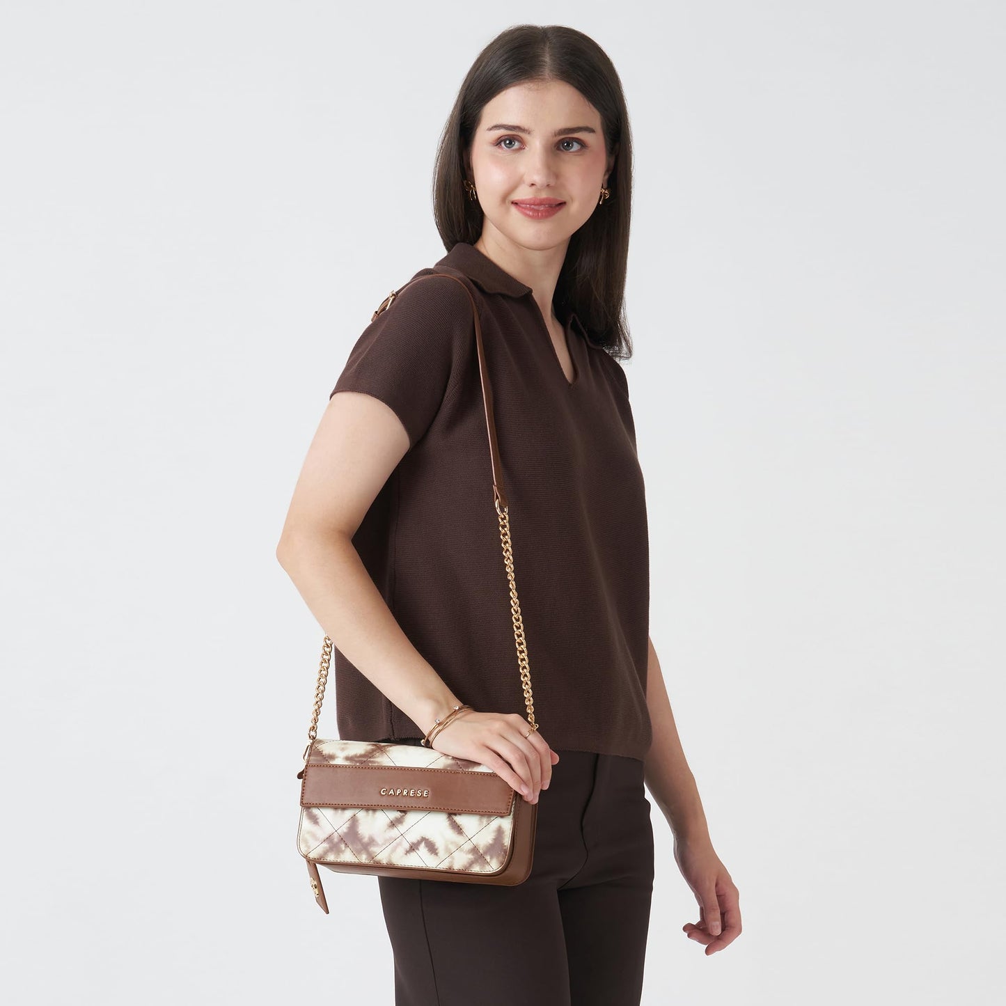 Caprese Shibori Medium Sling Bag for Women with Adjustable & Detachable Strap | Printed Faux Leather Shoulder Bag with Multi-Compartments | Zipper & Magnetic Button | Detachable Charm (Brown)