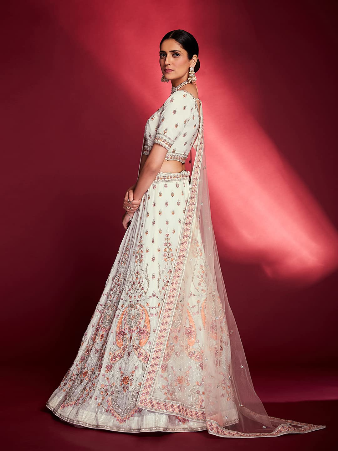 FUSIONIC This outfit is beautifully decorated intricately with sequin and zarkan. The White georgette lehenga will come with matching dupatta and blouse.