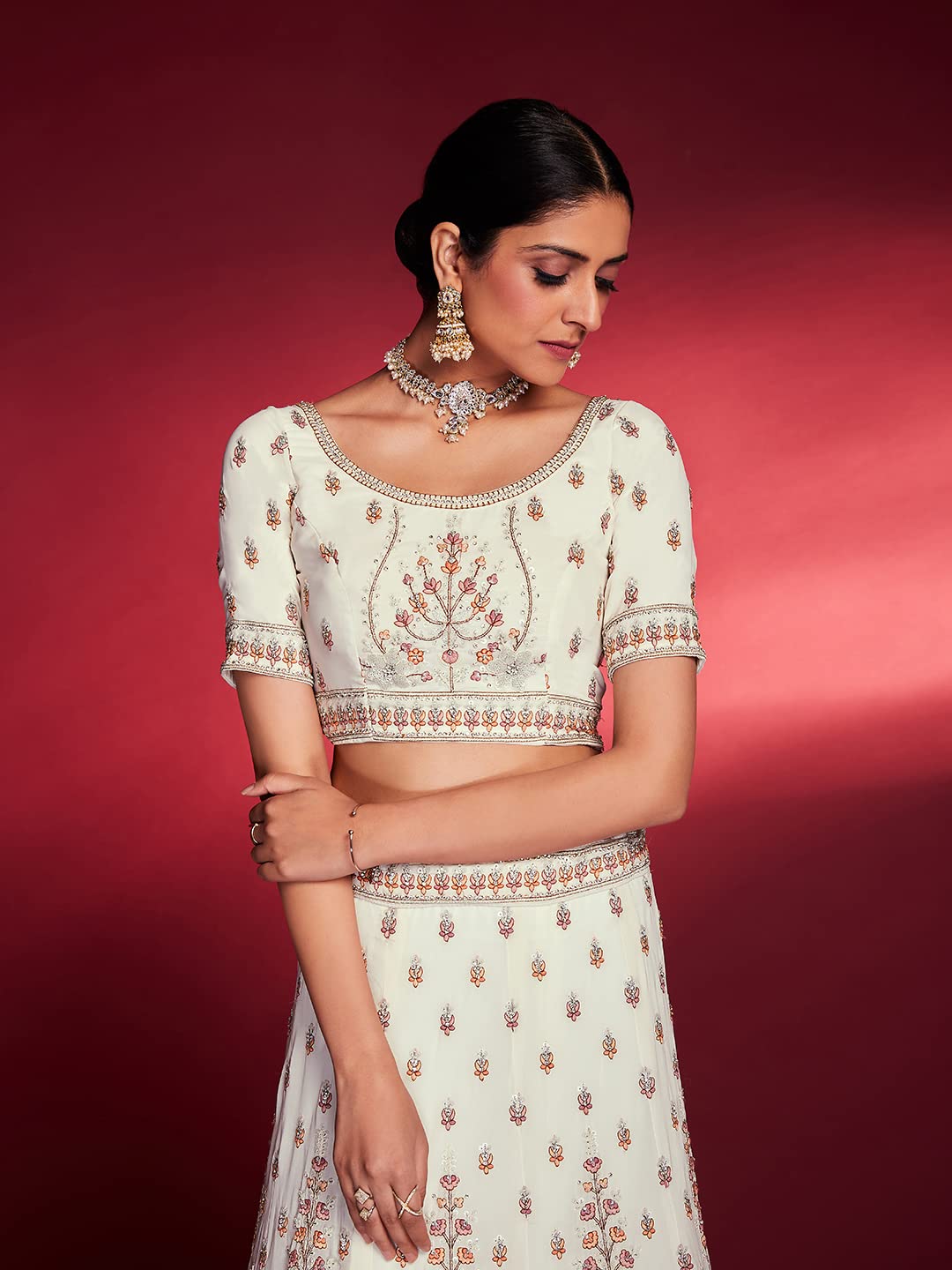 FUSIONIC This outfit is beautifully decorated intricately with sequin and zarkan. The White georgette lehenga will come with matching dupatta and blouse.