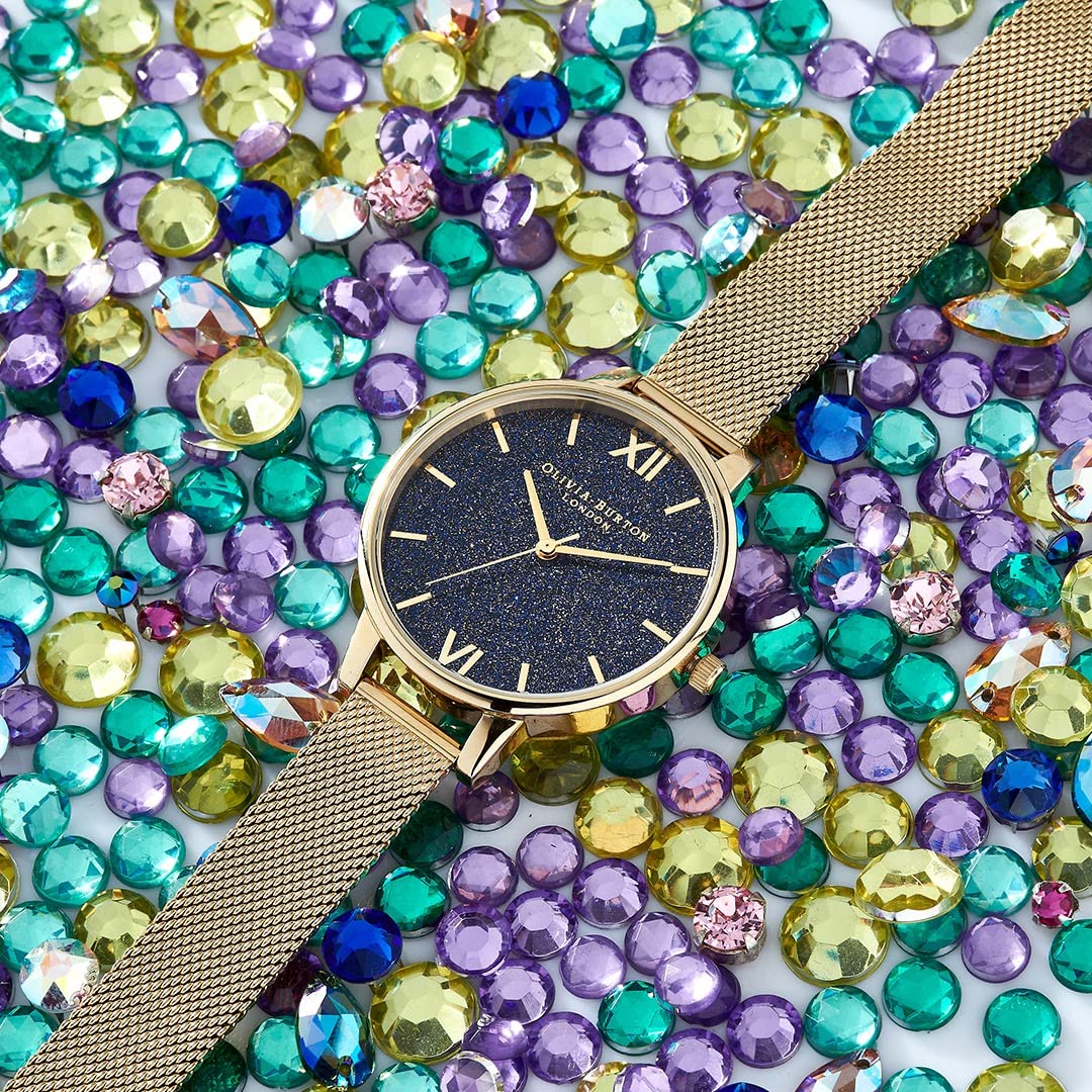 Olivia burton Glitter Dial Qtz Basic Blue Round Dial Women's Watch|Ionic Plated Gold Steel Material|Gold Color Band - OB16GD75