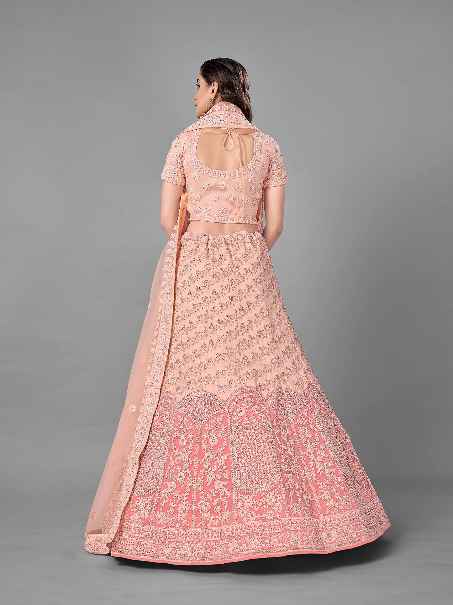 FUSIONIC Peach Color Soft Net Material Stone Work Lehenga Choli For Women