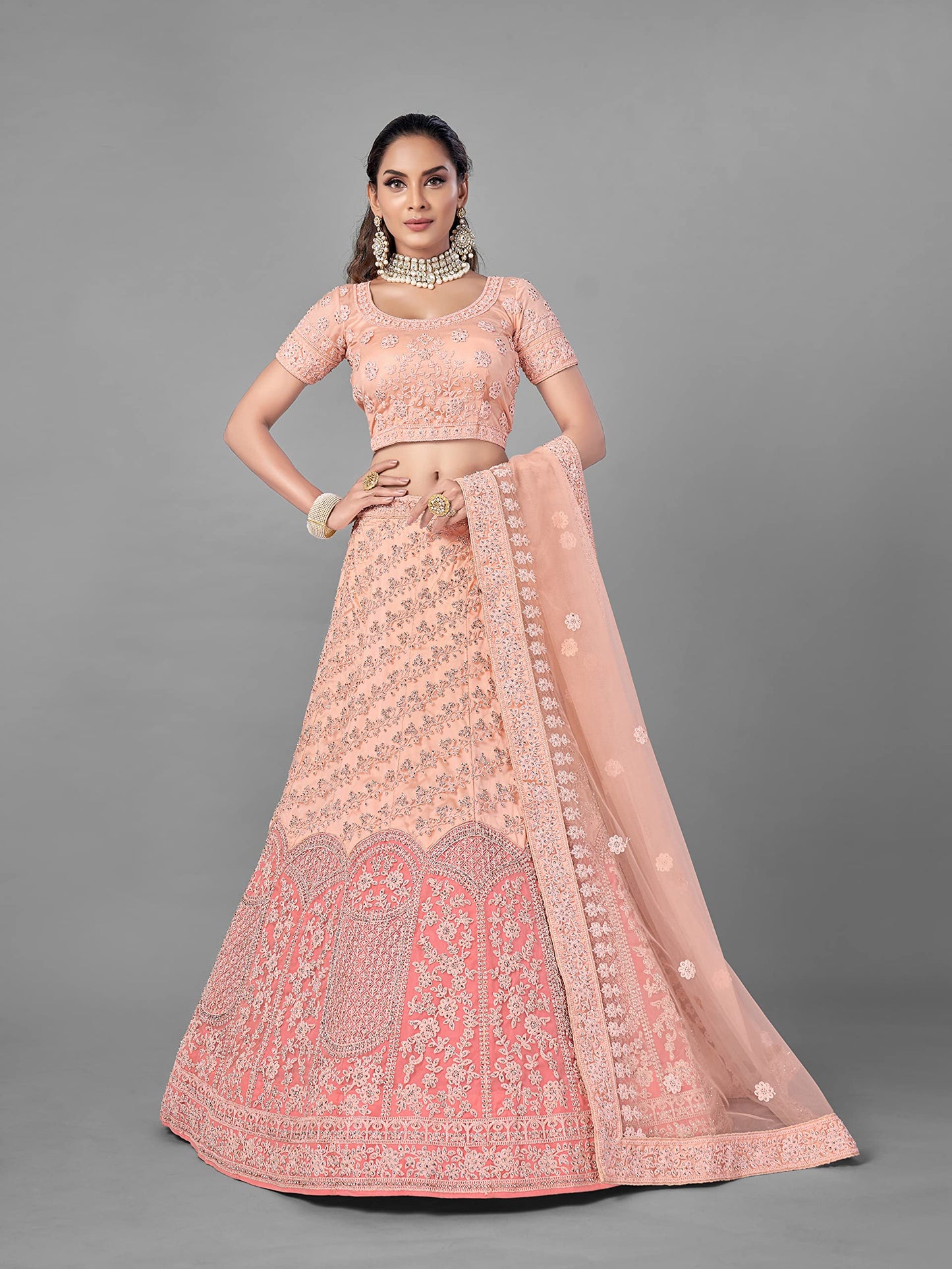 FUSIONIC Peach Color Soft Net Material Stone Work Lehenga Choli For Women