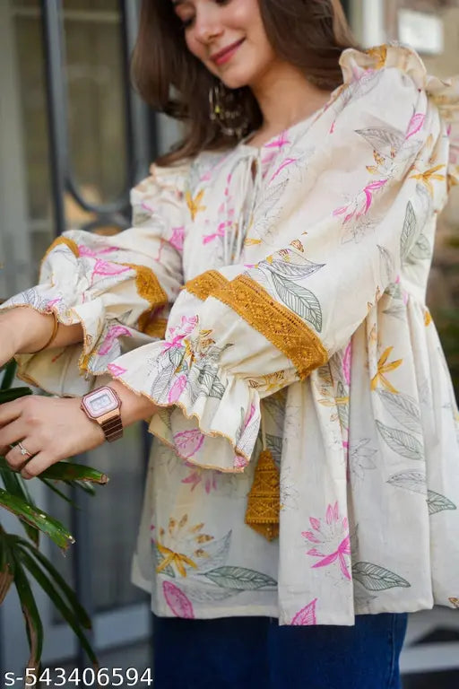 Cream colour cotton fabric printed oversized top for party and festive wear