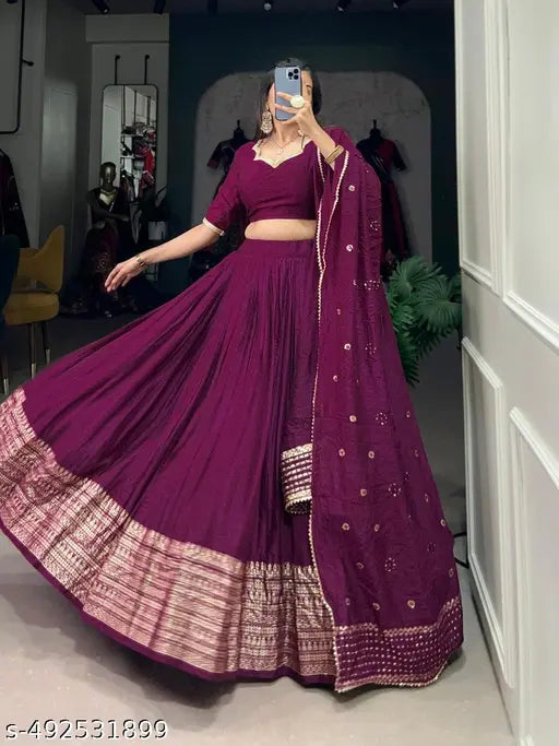 Experience timeless elegance with our Pure Chanderi Plain Lehenga, featuring an intricate Zari work border, perfectly paired with a sequin-embellished dupatta for added charm.