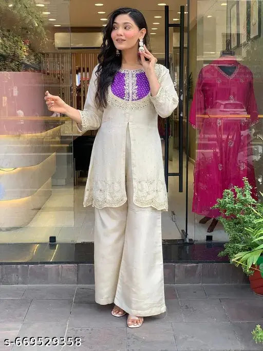 effortless grace to your ethnic collection with this elegants off-white kurti palazzo set